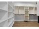 Spacious walk-in closet featuring custom shelving and storage solutions at 26 Moraine Dr, Henderson, NV 89052