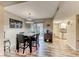 Cozy dining area with a modern table set, wood floors, and access to a patio at 2632 Matogroso Ln, Las Vegas, NV 89121