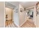 Light and bright hallway with wood floors leads to bedrooms at 2632 Matogroso Ln, Las Vegas, NV 89121