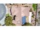 Aerial view of the roof shows the solar panel installation and the desert landscaping at 2971 Fort Matanzas Ter, Henderson, NV 89052