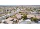 Expansive aerial view of a single-story home in a desert community with a golf course and mountain views at 2971 Fort Matanzas Ter, Henderson, NV 89052
