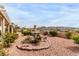 Serene backyard garden featuring a charming fountain and scenic mountain views at 2971 Fort Matanzas Ter, Henderson, NV 89052