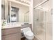 Bathroom featuring a shower with glass doors, toilet and vanity with a mirror at 2971 Fort Matanzas Ter, Henderson, NV 89052