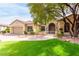 Charming single-story home featuring a well-manicured lawn, mature trees, and a brick-paved driveway leading to a two-car garage at 2971 Fort Matanzas Ter, Henderson, NV 89052