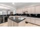 Well-equipped kitchen with large island, stainless steel appliances, and granite countertops at 2971 Fort Matanzas Ter, Henderson, NV 89052