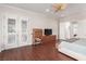 Spacious main bedroom with wood floors, ceiling fan, and private doors to the outside at 2971 Fort Matanzas Ter, Henderson, NV 89052