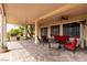 Spacious covered patio featuring comfortable seating, outdoor kitchen, and beautiful brick flooring at 2971 Fort Matanzas Ter, Henderson, NV 89052
