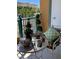 Balcony with table set for two and green tree decoration at 30 Strada Di Villaggio # 439, Henderson, NV 89011