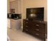Bedroom with kitchenette and large TV at 30 Strada Di Villaggio # 439, Henderson, NV 89011