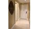 Clean, bright hallway featuring tile floors and white doors providing access to various rooms at 30 Strada Di Villaggio # 439, Henderson, NV 89011