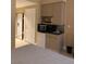 Compact kitchenette equipped with a mini-fridge, microwave, and sink, perfect for convenient meal preparation at 30 Strada Di Villaggio # 439, Henderson, NV 89011