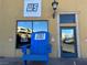Quaint building with Lake Las Vegas signage and a large, blue Adirondack chair at 30 Strada Di Villaggio # 439, Henderson, NV 89011