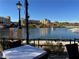 Picturesque lake view from outdoor seating with mountains and beautiful buildings at 30 Strada Di Villaggio # 439, Henderson, NV 89011