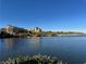 Expansive lake view showing waterfront homes and calm waters under a clear blue sky at 30 Strada Di Villaggio # 439, Henderson, NV 89011
