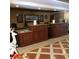 Inviting lobby area with wood counters, tiled floors, and decorative accents providing a warm reception at 30 Strada Di Villaggio # 439, Henderson, NV 89011