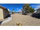 Expansive backyard with desert landscaping, block wall and covered patio creating a tranquil outdoor space at 3407 Bristlecone St, Las Vegas, NV 89146