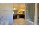 Bright bathroom features a double vanity, a shower with glass doors, and a separate soaking tub at 3407 Bristlecone St, Las Vegas, NV 89146