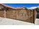 Ornate metal security gate leading to the house, offering both curb appeal and privacy at 3407 Bristlecone St, Las Vegas, NV 89146