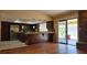 An open kitchen featuring stainless steel appliances and a bar, with access to the backyard at 3407 Bristlecone St, Las Vegas, NV 89146
