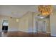 Bright living room featuring wood floors, high ceilings and chandelier style lighting at 3407 Bristlecone St, Las Vegas, NV 89146