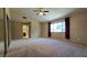 Spacious main bedroom with carpet flooring, large windows, and an en-suite bathroom at 3407 Bristlecone St, Las Vegas, NV 89146