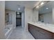 Bathroom with a double vanity, walk in shower, and a luxurious soaking tub at 353 E Bonneville Ave # 125, Las Vegas, NV 89101