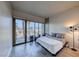 Bedroom has large windows, a workspace, and modern decor at 353 E Bonneville Ave # 125, Las Vegas, NV 89101