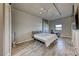 Bedroom features a bed, desk, tv, and large window providing natural light and city views at 353 E Bonneville Ave # 125, Las Vegas, NV 89101