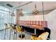 Stylish dining area with modern lighting, gold chairs, and a unique wood table at 353 E Bonneville Ave # 125, Las Vegas, NV 89101