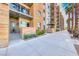 Beautiful condo exterior featuring multiple levels, balconies, and meticulous landscaping with palm trees at 353 E Bonneville Ave # 125, Las Vegas, NV 89101