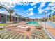 Inviting pool area with colorful lounge furniture, fire pit and lush landscaping at 353 E Bonneville Ave # 125, Las Vegas, NV 89101