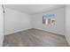 A simple bedroom with clean lines, neutral walls and a window providing natural light at 3597 Arville St # 201B, Las Vegas, NV 89103