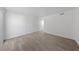 Empty bedroom showing light wood-look flooring and white walls at 3597 Arville St # 201B, Las Vegas, NV 89103