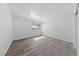 A simple bedroom with clean lines, neutral walls and a window providing natural light at 3597 Arville St # 201B, Las Vegas, NV 89103