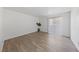 An empty bedroom featuring light wood-look flooring and a sliding glass door at 3597 Arville St # 201B, Las Vegas, NV 89103