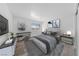 Bright bedroom featuring a comfortable bed, stylish decor, and natural light from the window at 3597 Arville St # 201B, Las Vegas, NV 89103