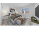 Bedroom featuring natural light, comfortable bed, TV and stylish decor at 3597 Arville St # 201B, Las Vegas, NV 89103