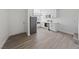Bright, open kitchen featuring stainless appliances, white cabinets, marble countertops and a spacious eating area at 3597 Arville St # 201B, Las Vegas, NV 89103