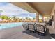 Beautiful backyard featuring a sparkling pool, patio seating, and lush landscaping at 386 Cactus River Ct, Henderson, NV 89052