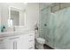 Modern bathroom with marble shower, updated fixtures, and a white vanity at 386 Cactus River Ct, Henderson, NV 89052
