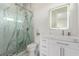 Contemporary bathroom with glass shower, updated fixtures, and a white vanity at 386 Cactus River Ct, Henderson, NV 89052