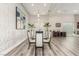 Elegant dining room with modern lighting, stylish decor, and seating for eight at 386 Cactus River Ct, Henderson, NV 89052