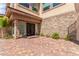 Attractive home featuring stone accents and a front door with side windows at 386 Cactus River Ct, Henderson, NV 89052