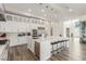 Contemporary kitchen with a large island, stainless steel appliances, and a beverage cooler at 386 Cactus River Ct, Henderson, NV 89052