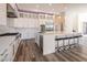 Modern kitchen with white cabinets, stainless steel appliances, a center island, and bar stool seating at 386 Cactus River Ct, Henderson, NV 89074