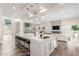 Contemporary living space featuring a modern kitchen with a large island and a comfortable living area at 386 Cactus River Ct, Henderson, NV 89052