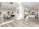 Spacious living room with a dining table, modern lighting, and wood-look flooring at 386 Cactus River Ct, Henderson, NV 89052