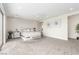 Bright main bedroom with a comfortable seating area and stylish artwork at 386 Cactus River Ct, Henderson, NV 89052