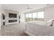 Spacious main bedroom with modern fireplace and large windows offering a scenic view at 386 Cactus River Ct, Henderson, NV 89052