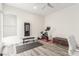 A home office and gym featuring a ceiling fan and wood flooring at 386 Cactus River Ct, Henderson, NV 89052